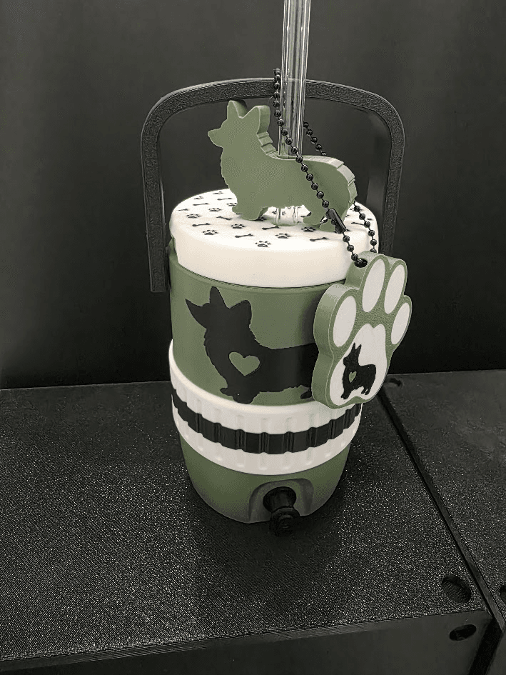 Green dog breed koozie with straw topper and paw tag