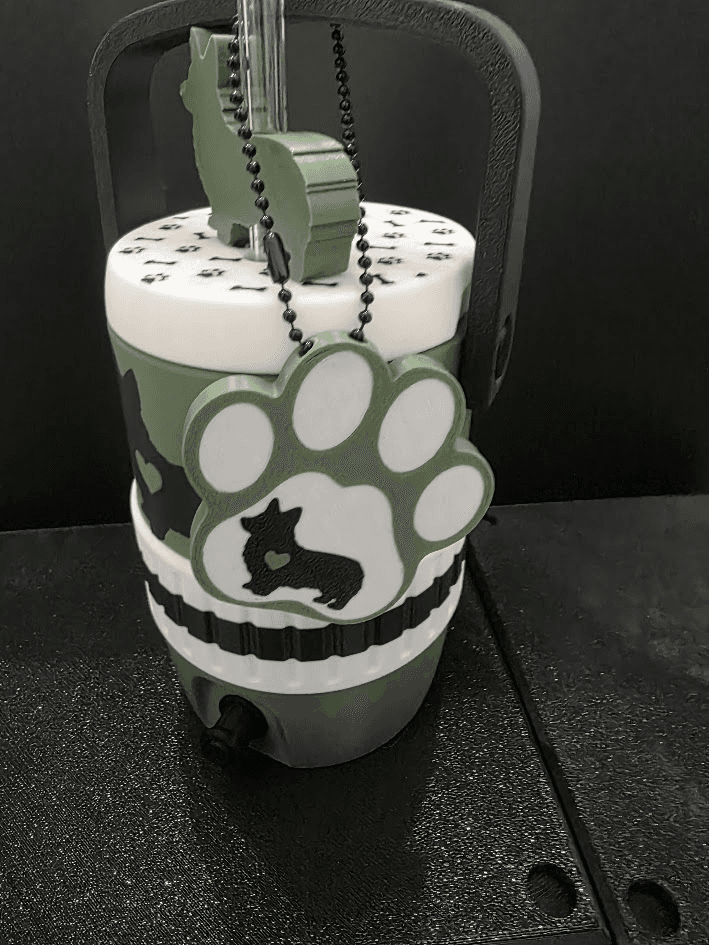 Close-up of paw tag on dog breed koozie